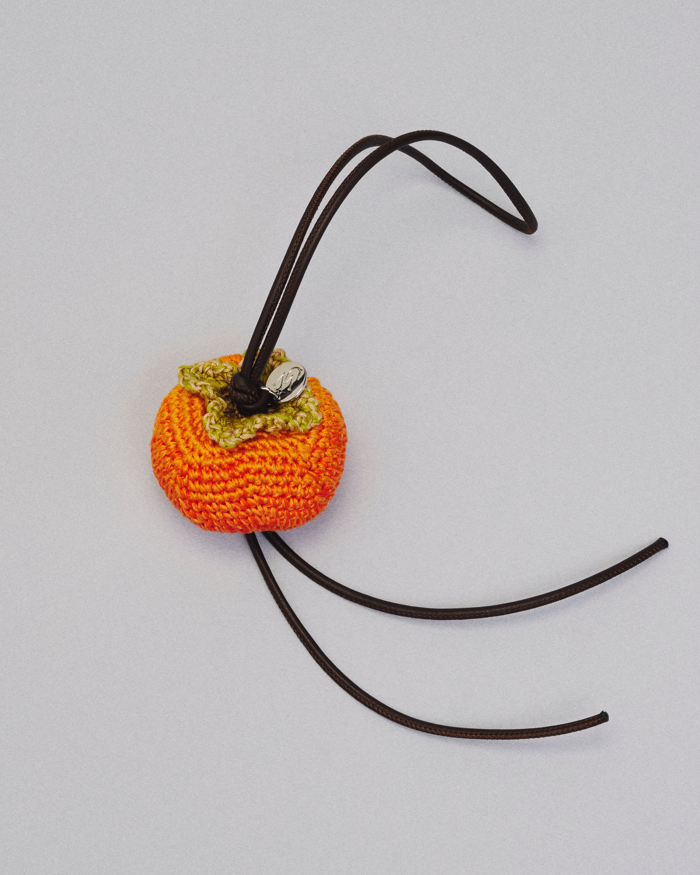HAND-CROCHETED PERSIMMON CHARM in ORANGE/GREEN AC0454FA0531703O/S