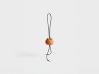 HAND-CROCHETED PERSIMMON CHARM