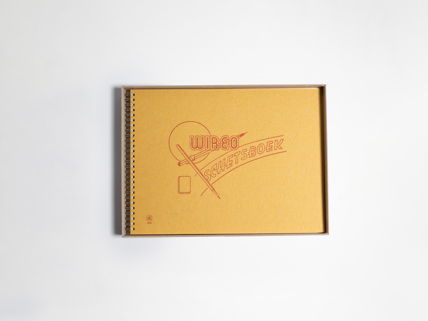 Yellow sketchbook with a logo on a white background