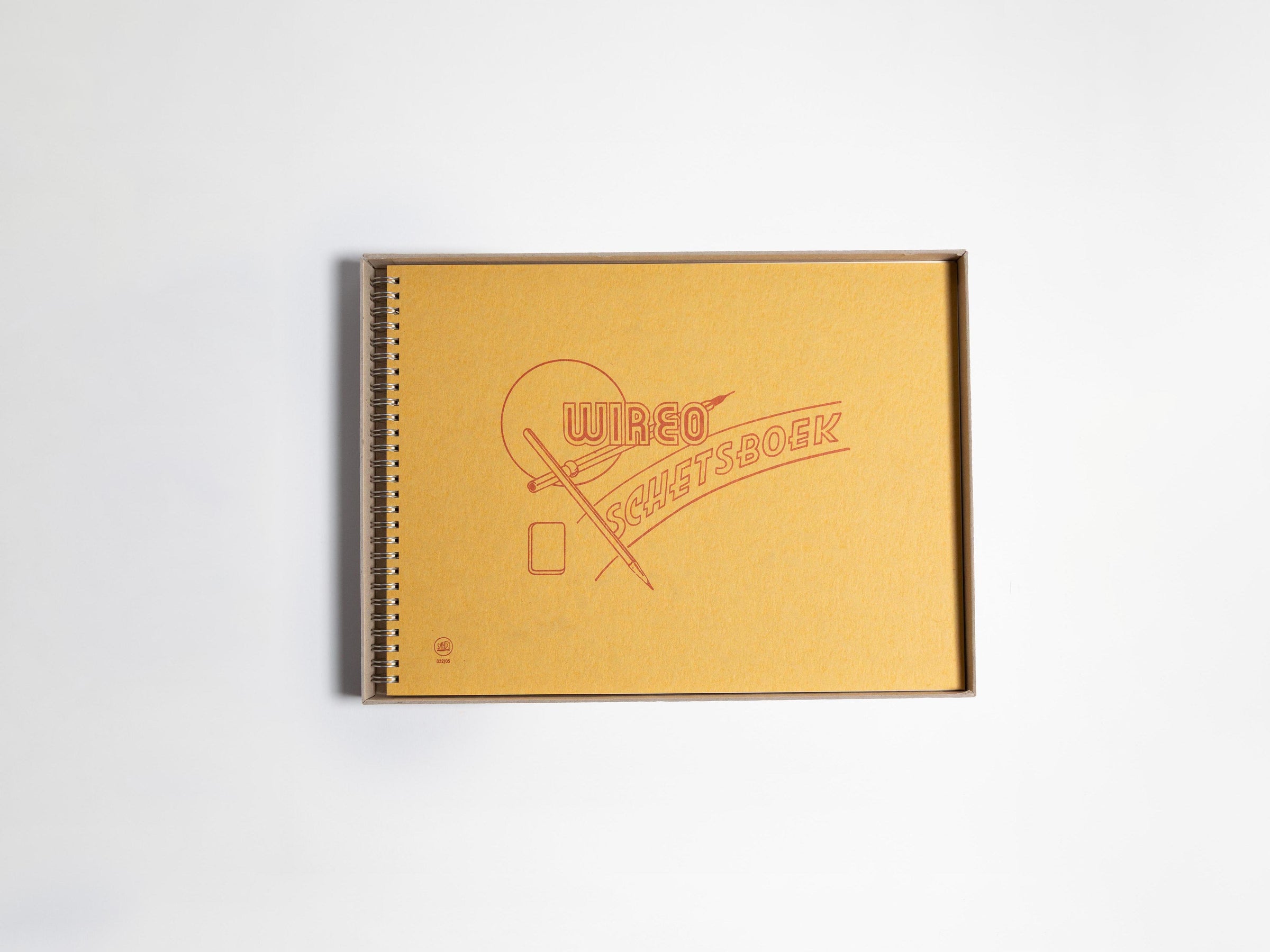 Yellow sketchbook with a logo on a white background