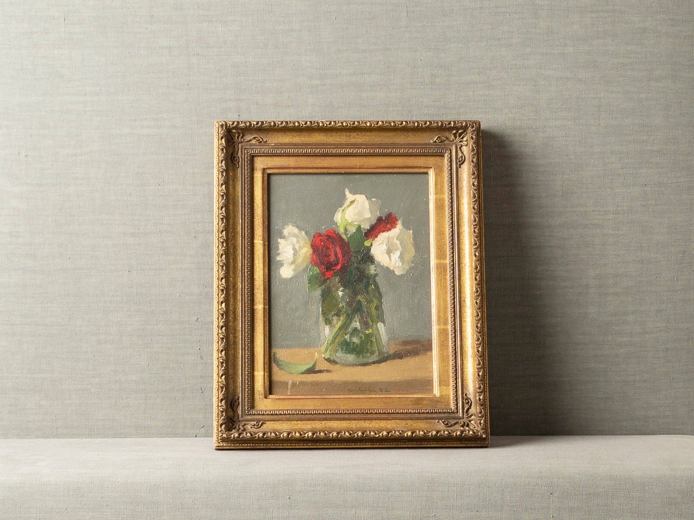 FULL-BLOWN RED AND WHITE ROSES IN A GLASS VASE BY ROBERT KULICKE