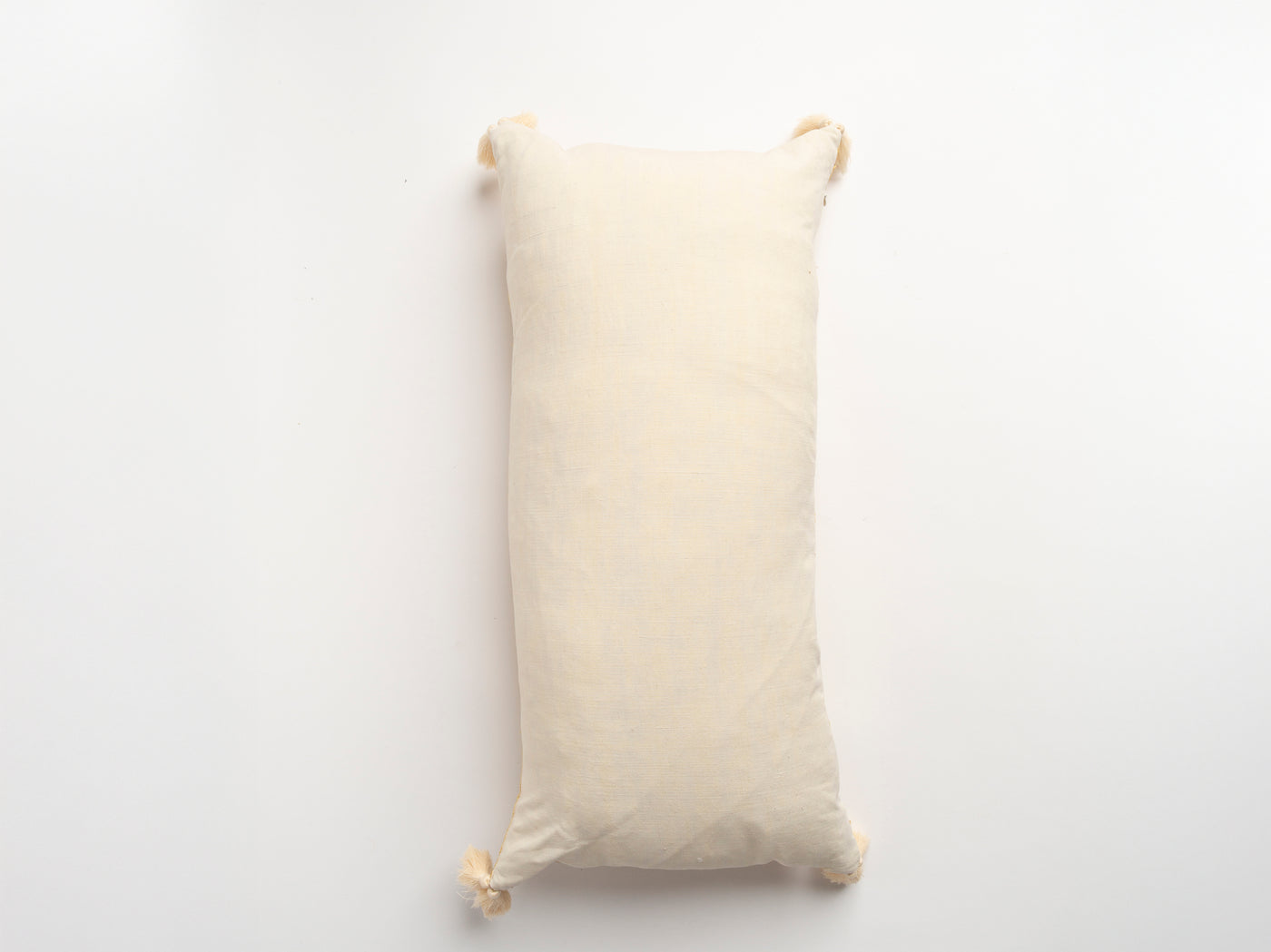 The Dyeworks Indian Silk Ajrakh Embroidered Bolster Cushion with Thai Tassels in Yellow