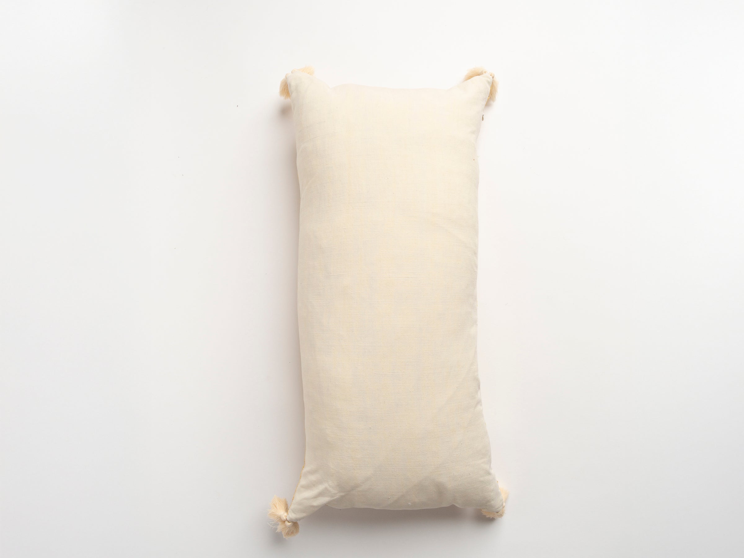 The Dyeworks Indian Silk Ajrakh Embroidered Bolster Cushion with Thai Tassels in Yellow