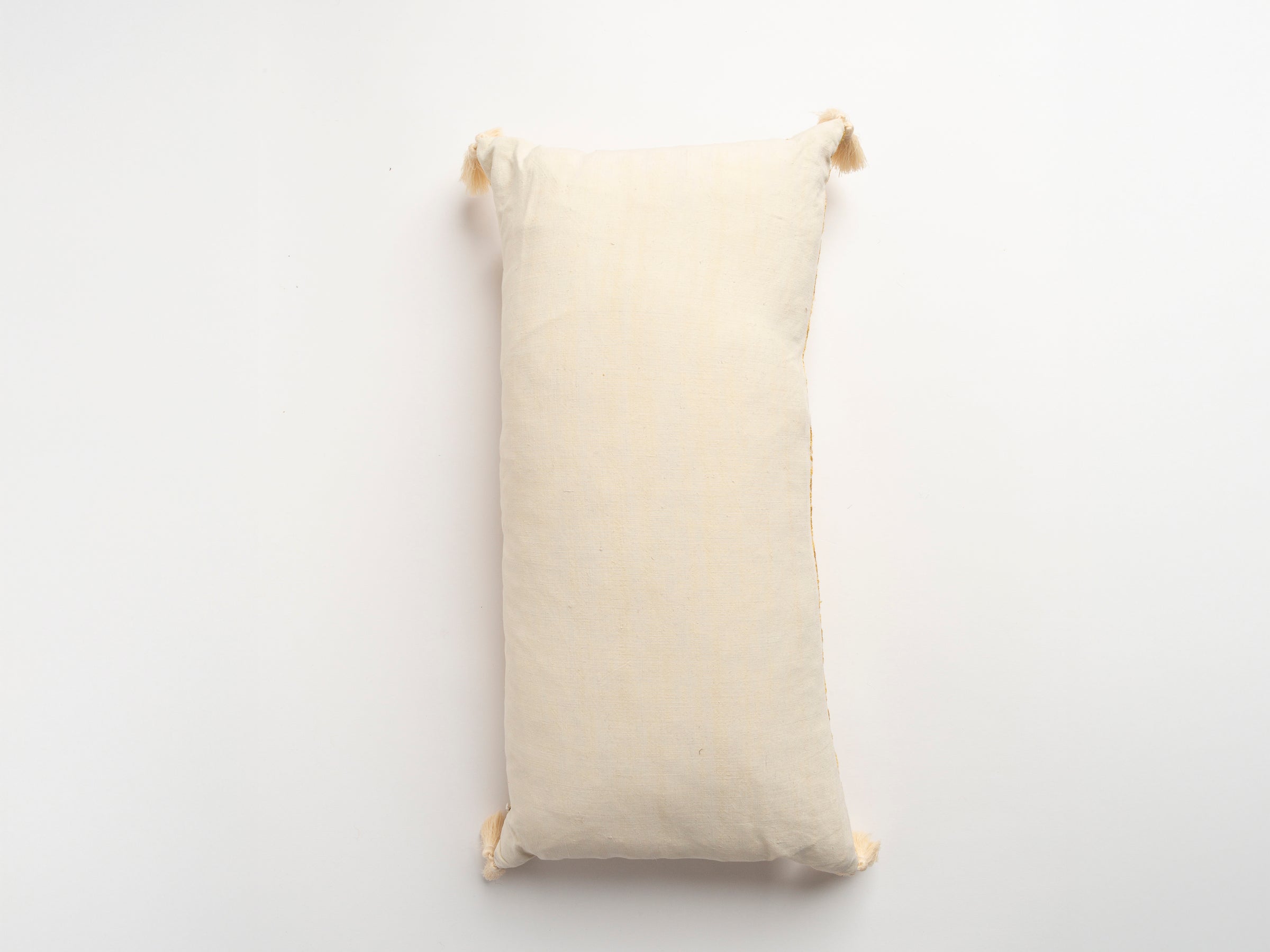 The Dyeworks Indian Silk Ajrakh Embroidered Bolster Cushion with Thai Tassels in Yellow