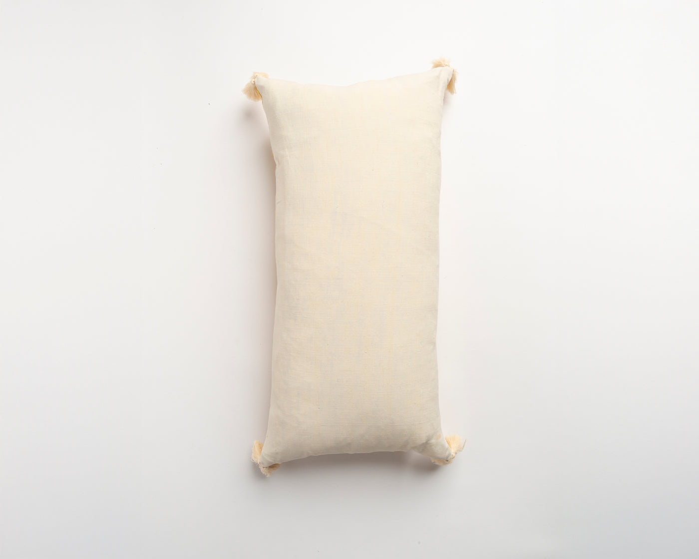 The Dyeworks Indian Silk Ajrakh Embroidered Bolster Cushion with Thai Tassels in Yellow