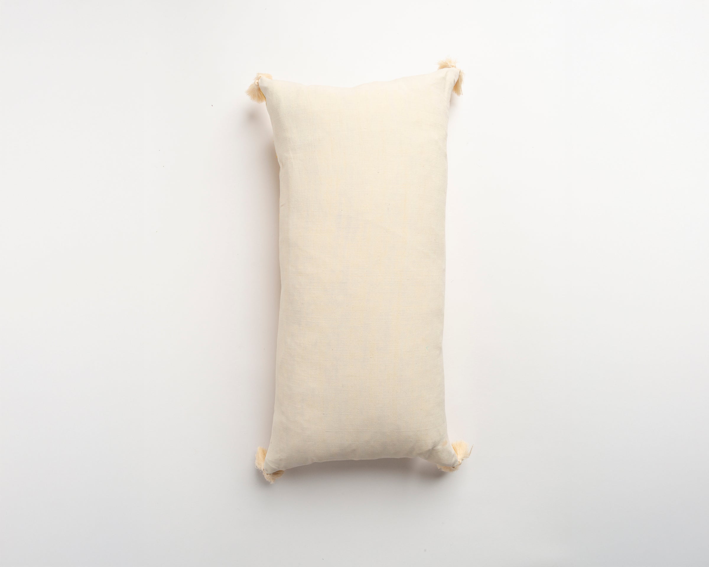 The Dyeworks Indian Silk Ajrakh Embroidered Bolster Cushion with Thai Tassels in Yellow