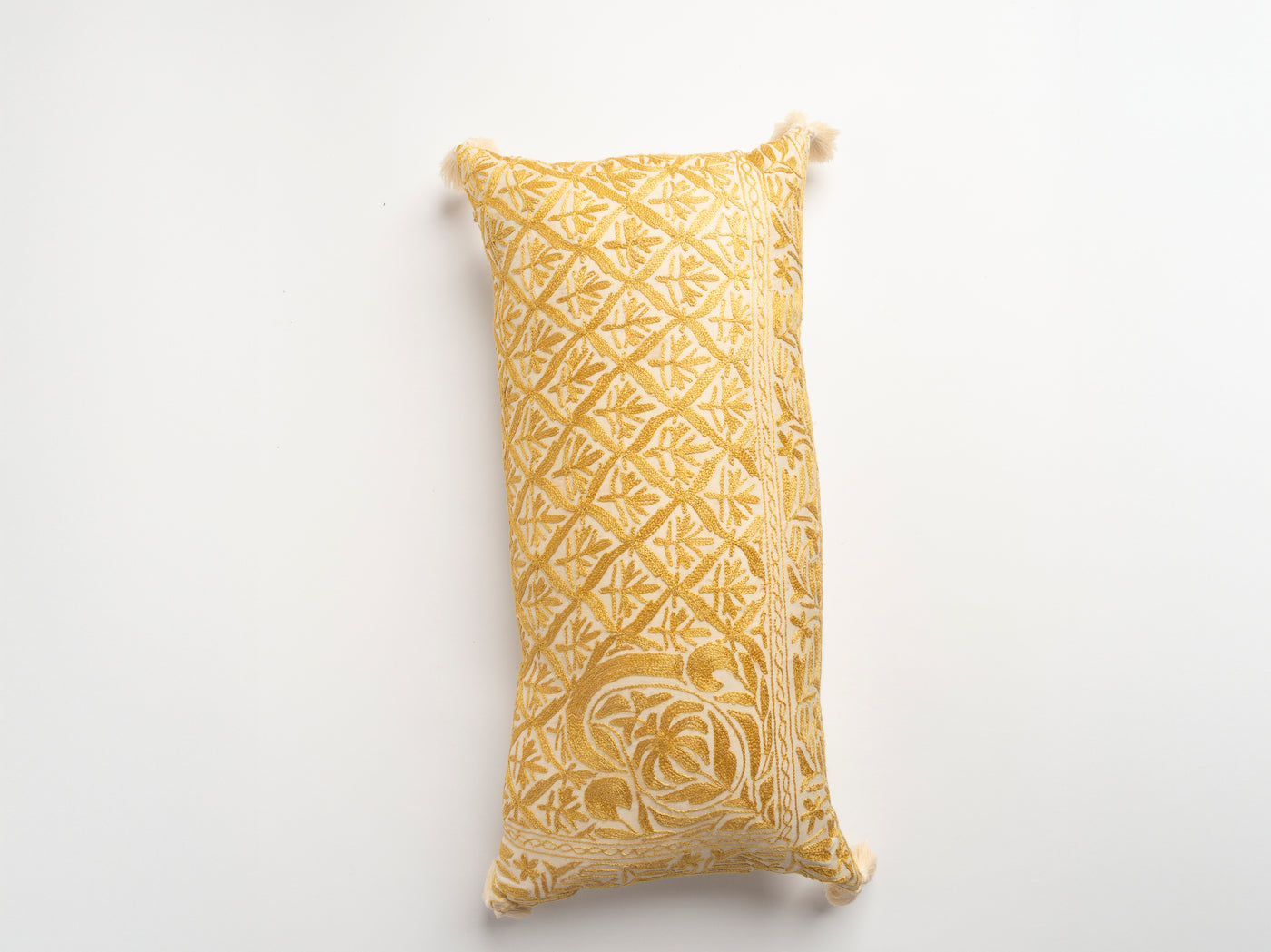 The Dyeworks Indian Silk Ajrakh Embroidered Bolster Cushion with Thai Tassels in Yellow