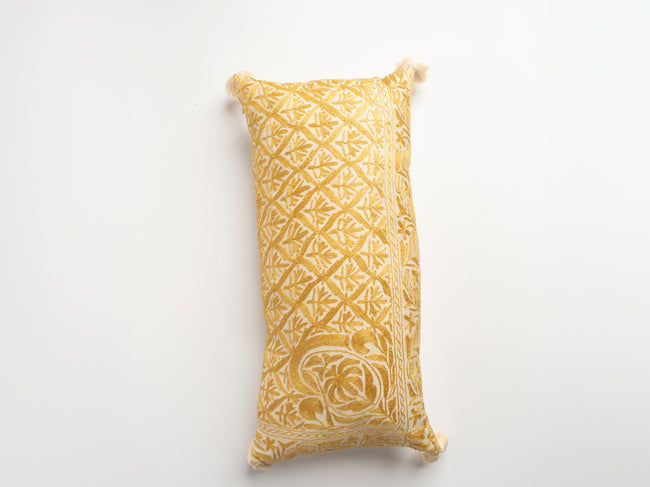 The Dyeworks Indian Silk Ajrakh Embroidered Bolster Cushion with Thai Tassels in Yellow