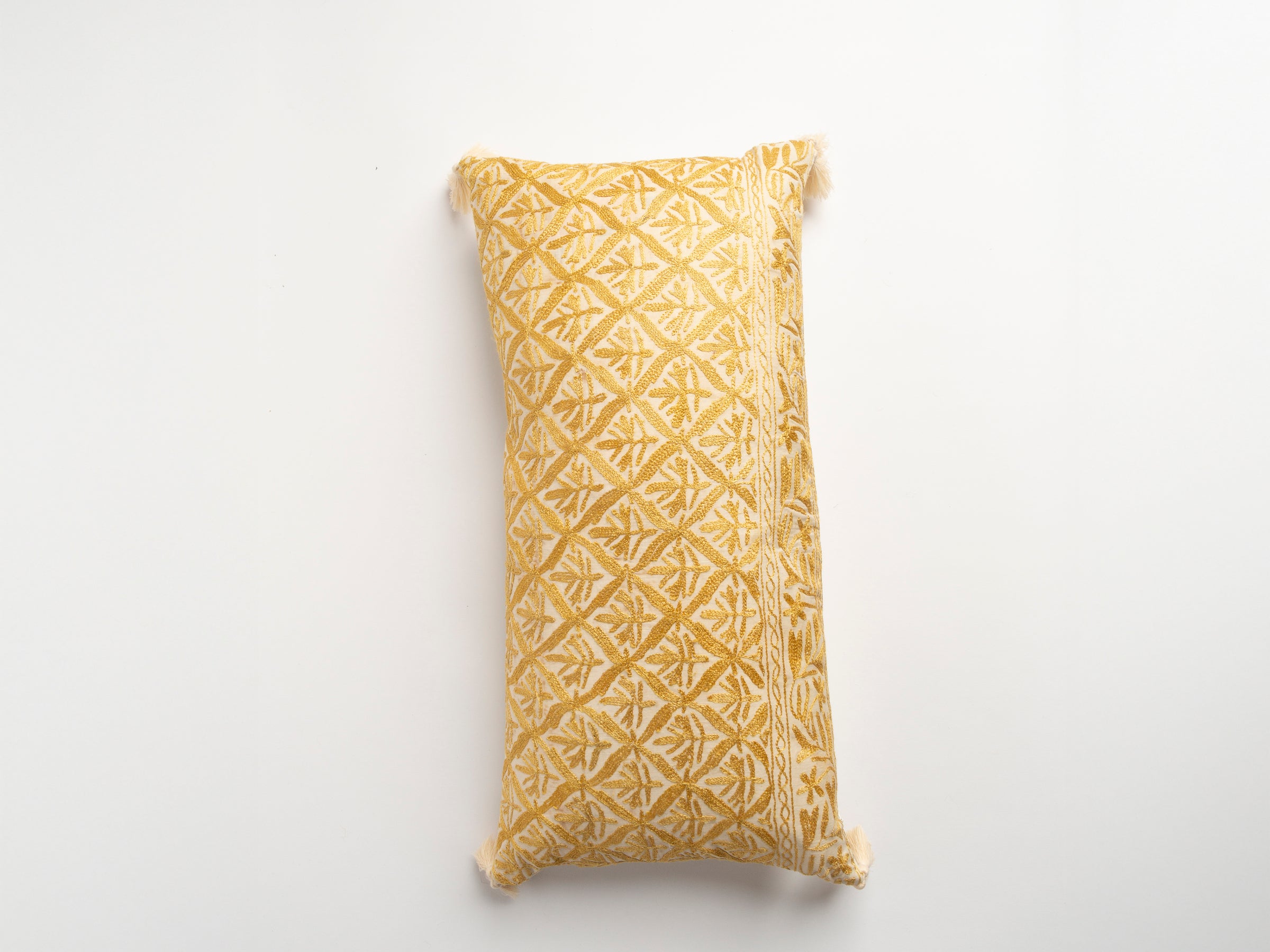 The Dyeworks Indian Silk Ajrakh Embroidered Bolster Cushion with Thai Tassels in Yellow