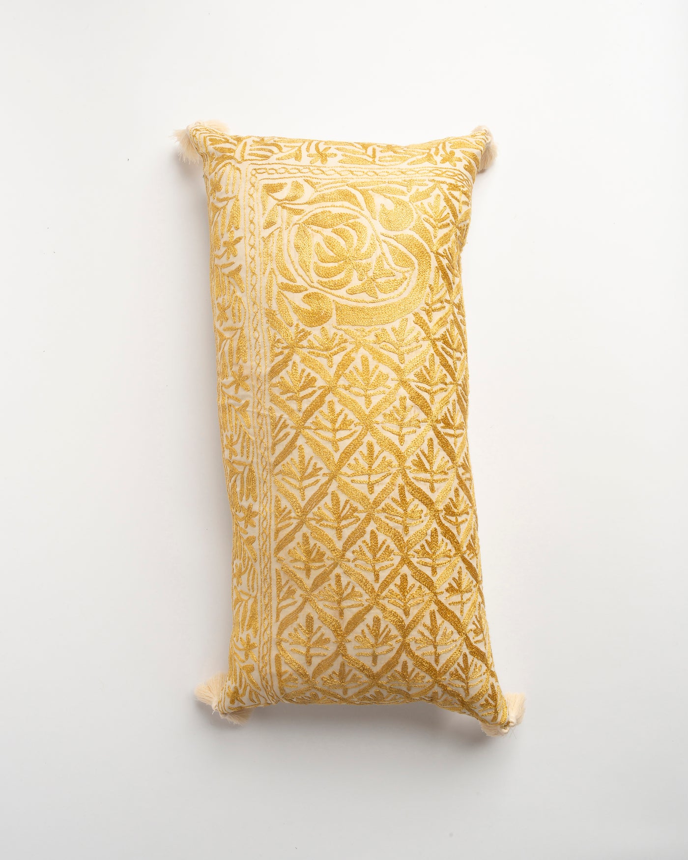 The Dyeworks Indian Silk Ajrakh Embroidered Bolster Cushion with Thai Tassels in Yellow