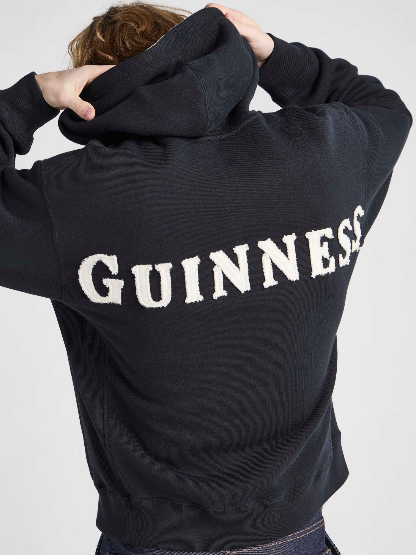 Unisex JW ANDERSON X GUINNESS HOODED SWEATSHIRT IN WASHED BLACK