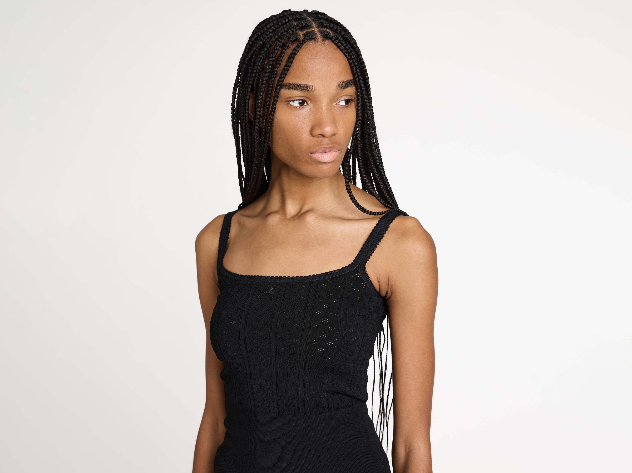 KNITTED POINTELLE CAMI TOP IN BLACK