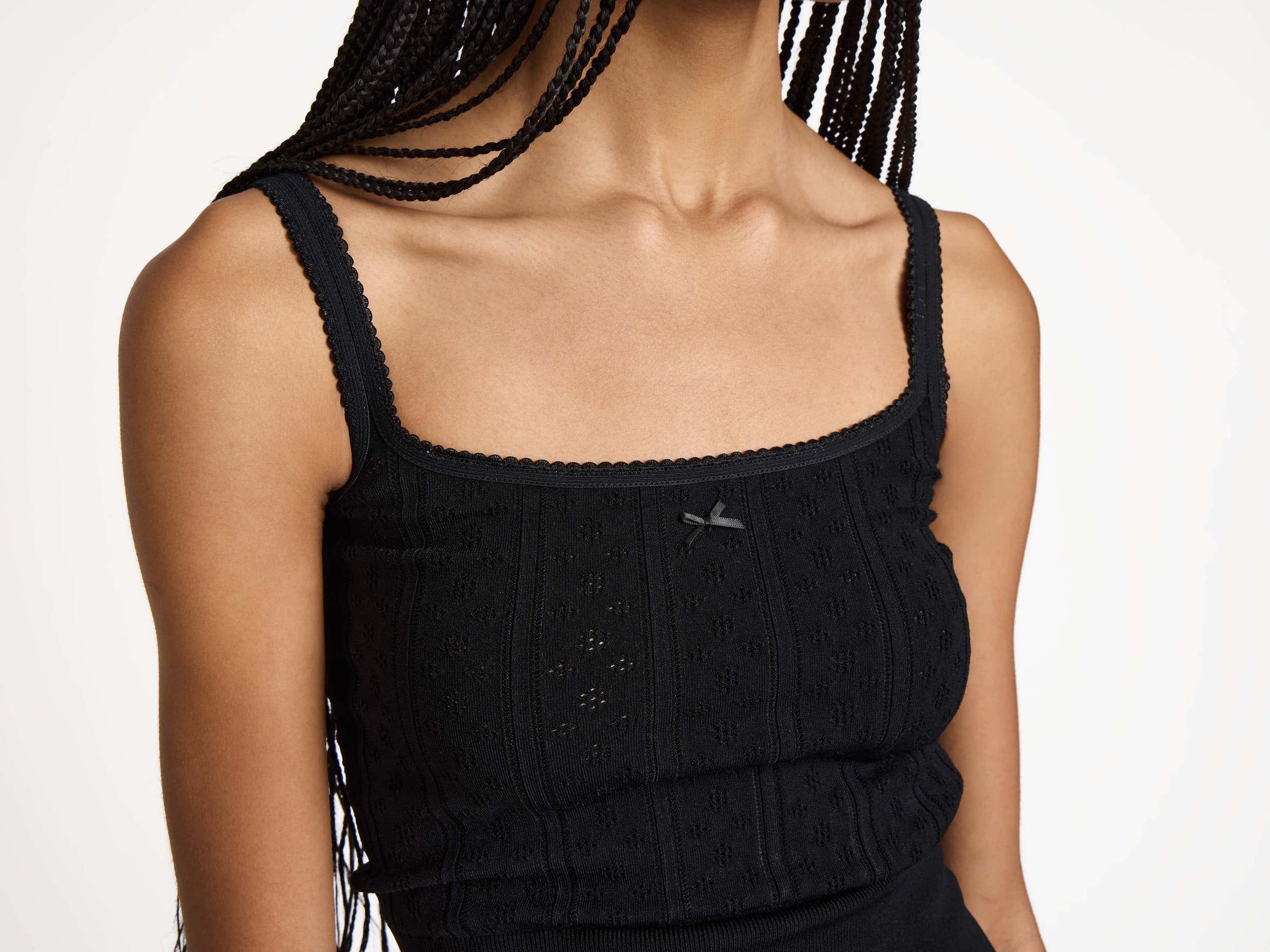 KNITTED POINTELLE CAMI TOP IN BLACK