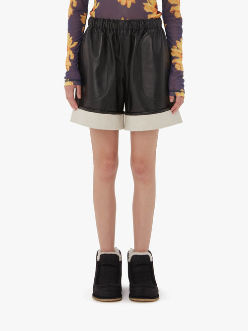 CONTRAST LEATHER HEM SHORTS